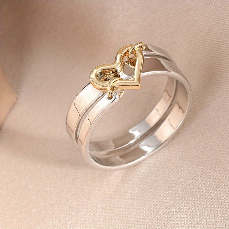 Zilverkleurige gelaagde ring met goudkleurig hart