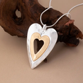 Tweekleurige ketting met dubbel hart