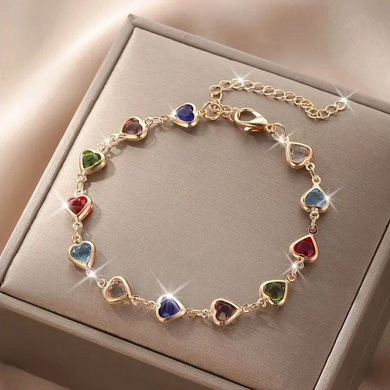 Goudkleurige armband met kleurrijke hartjes