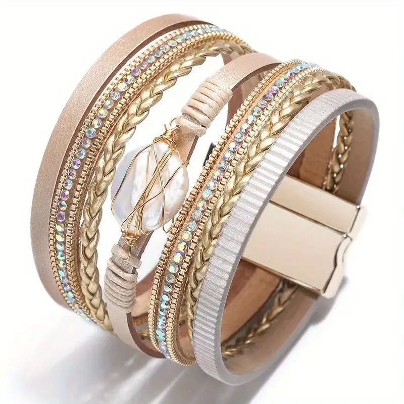 Goudkleurige armband van draad en leer