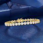 Goudkleurige armband met ronde kristallen
