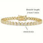Goudkleurige armband met ronde kristallen