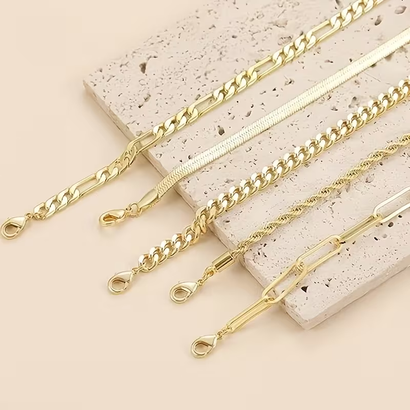 Goudkleurige tennisarmband met balletjesketting