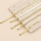 Goudkleurige tennisarmband met balletjesketting