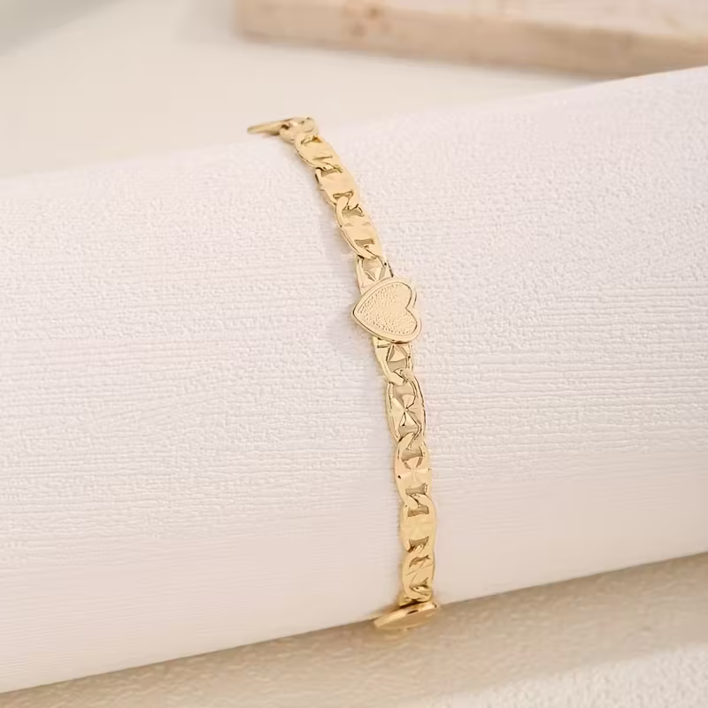 Goudkleurige Cubaanse schakelarmband met hart