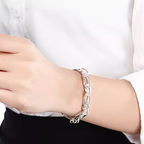 Zilverkleurige schakelarmband met clipschakels