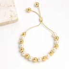 Goudkleurige armband met parelkralen