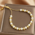 Goudkleurige armband met parelkralen