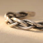 Gevlochten zilverkleurige armband