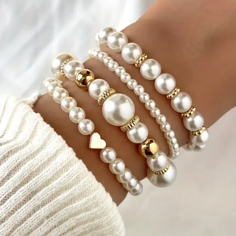 Set van bedelarmbanden met parel en goudkleur