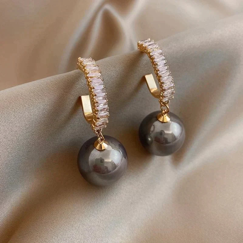 Oorbellen met parel en zirkonia in twee kleuren