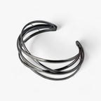 Open bangle met opengewerkt detail