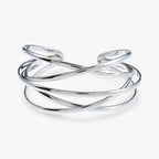 Open bangle met opengewerkt detail