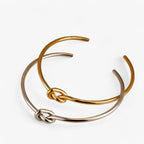 Gedraaide geweven armband in goudkleurig staal