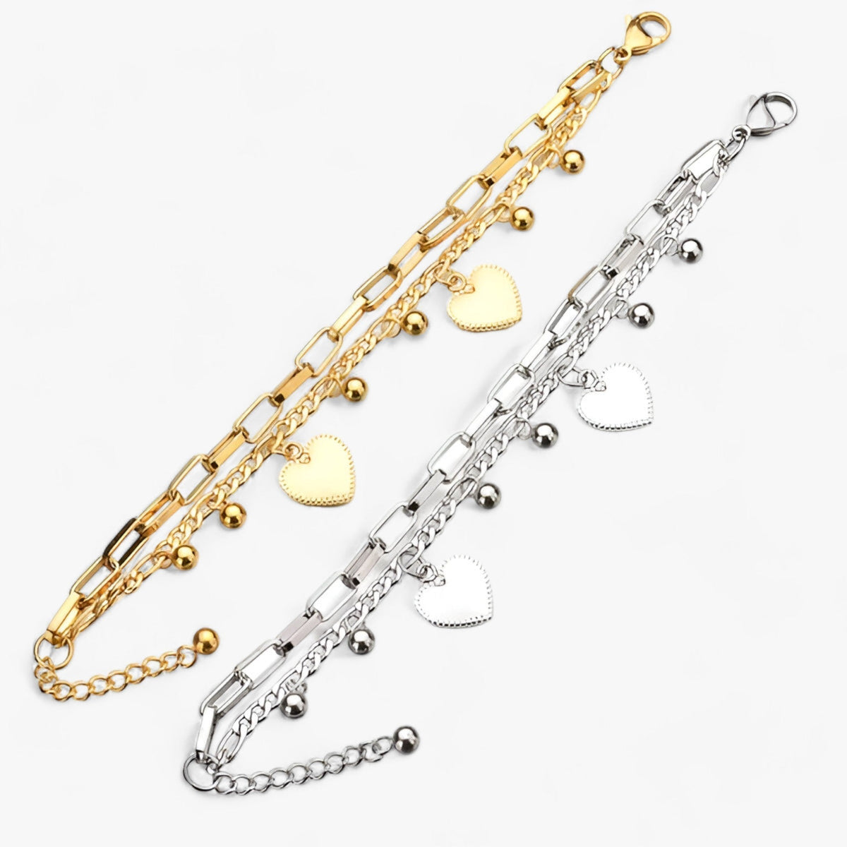 Tweelaagse schakelarmband met parels en hartbedel