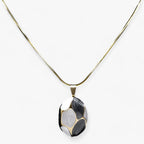 Ketting met bedelhanger in goudkleurig roestvrij staal