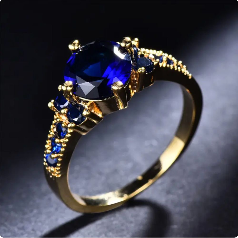 Gold-Tone Ring with Oval Blue Stone and Side Accents