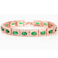 Smaragdgroene stenen statementarmband in goudkleurig metaalwerk