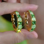 Oorbellen met groene diamantgeslepen steen