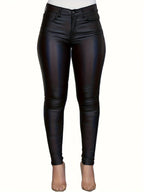 High-waist coated skinny jeans met medium stretch