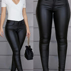 High-waist coated skinny jeans met medium stretch